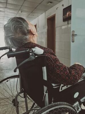 A frail elderly sitting on wheelchair with physical inactivity and sundown syndrome